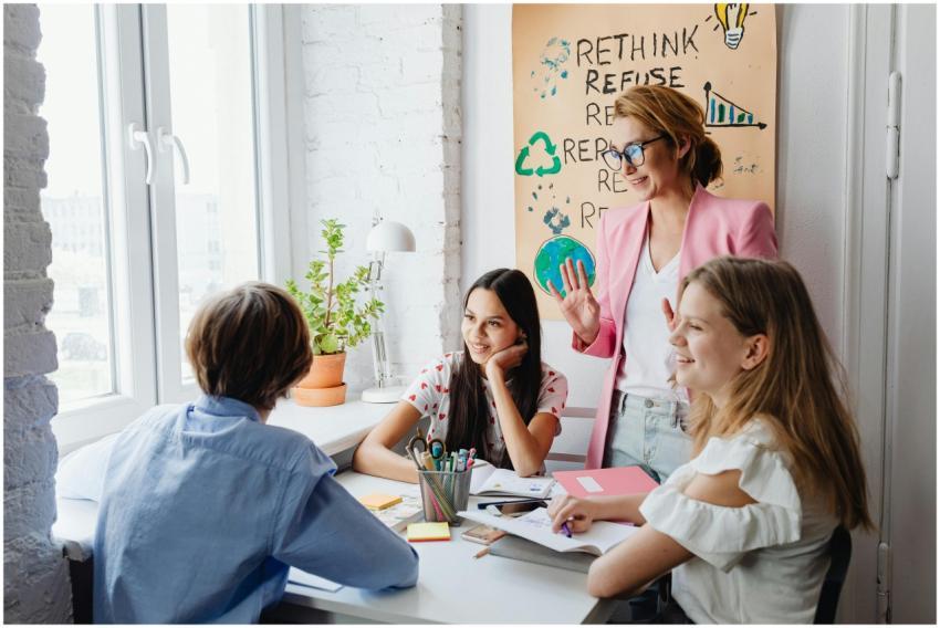 A teacher engages with students in a bright classr
