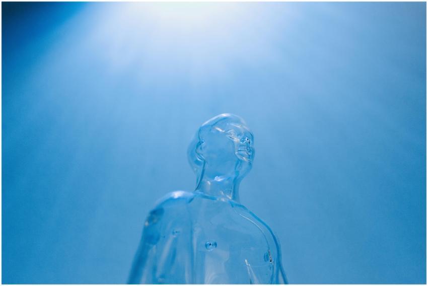 Transparent figure against a blue sky, symbolizing