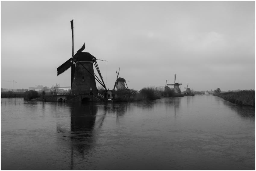 Stunning black and white photo of iconic windmills