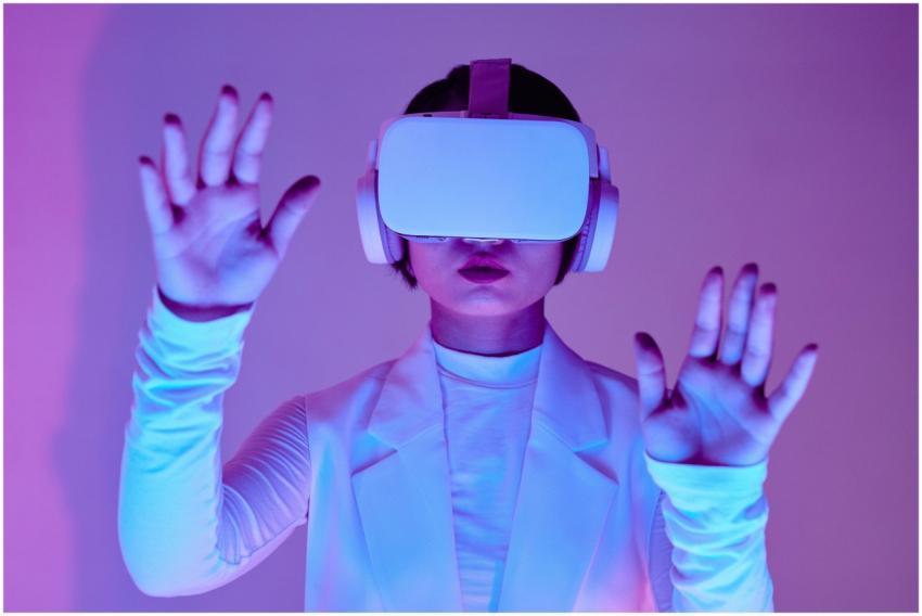 Woman in white long sleeves using virtual reality