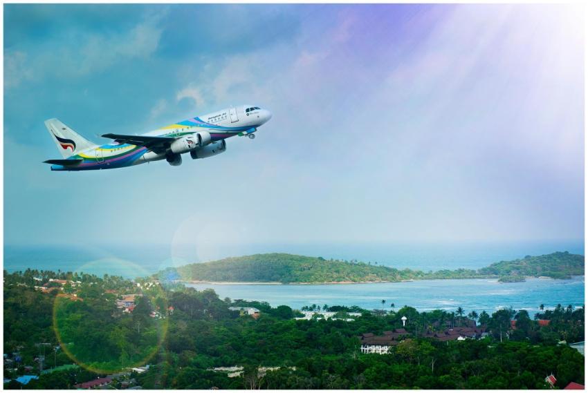 Airplane soaring over Koh Samui island, Thailand,