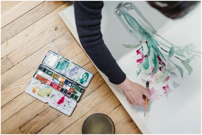 A creative top view of an artist painting with vib