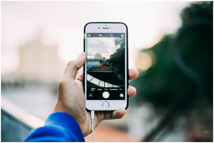 Close-up of a hand holding a smartphone while capt
