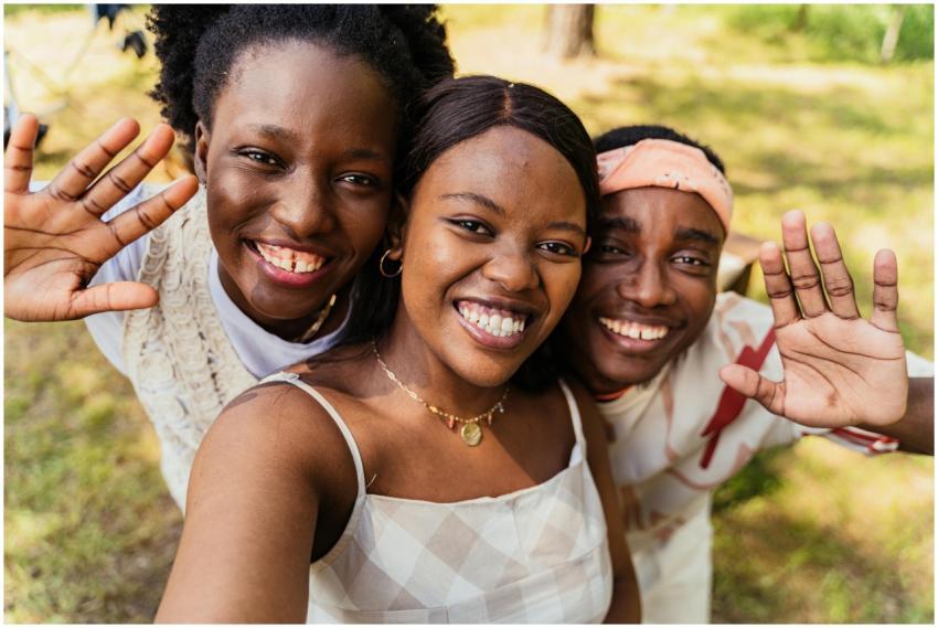 Three young friends capture a joyful outdoor selfi