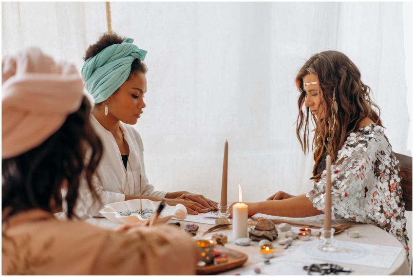 Three women engaging in a spiritual meditation ses
