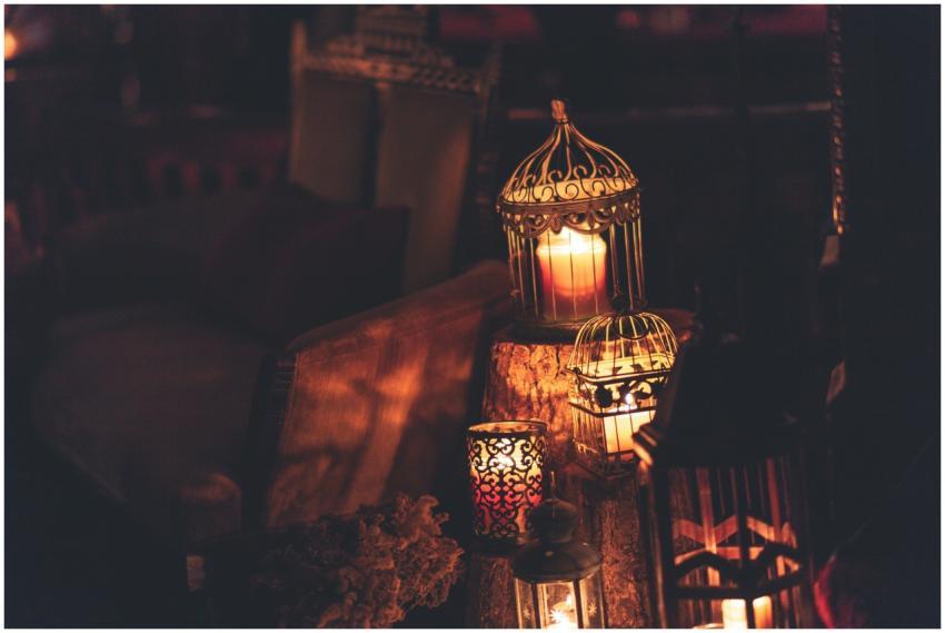 A cozy indoor scene with glowing lanterns and cand