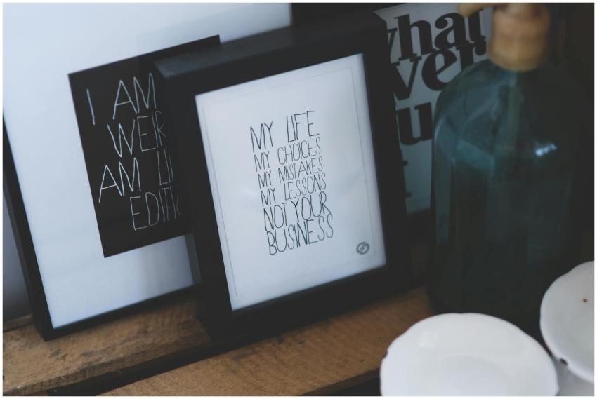 Framed typography with motivational quotes on a wo