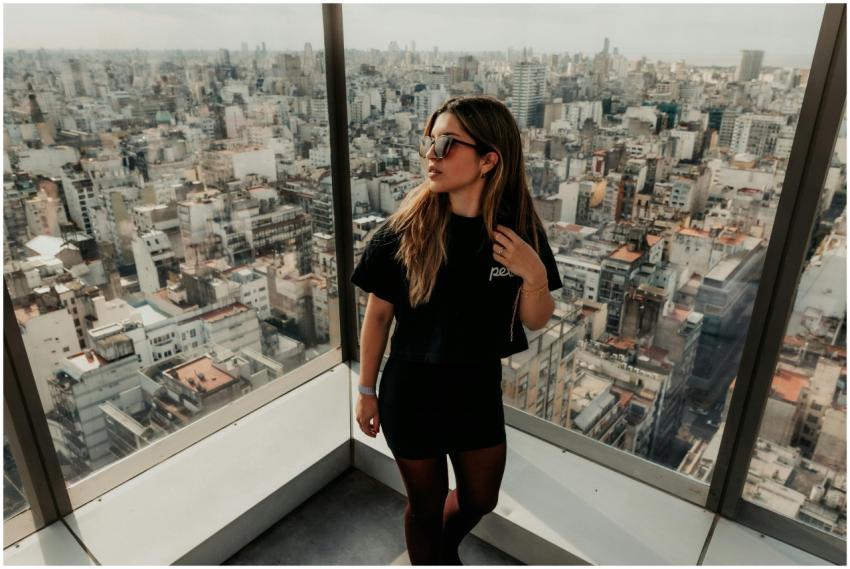 Stylish woman overlooking Buenos Aires cityscape f