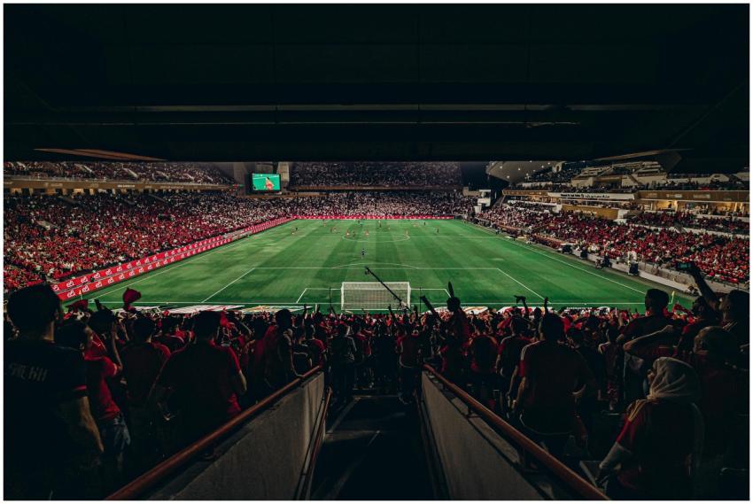 An exciting football match with passionate fans fi