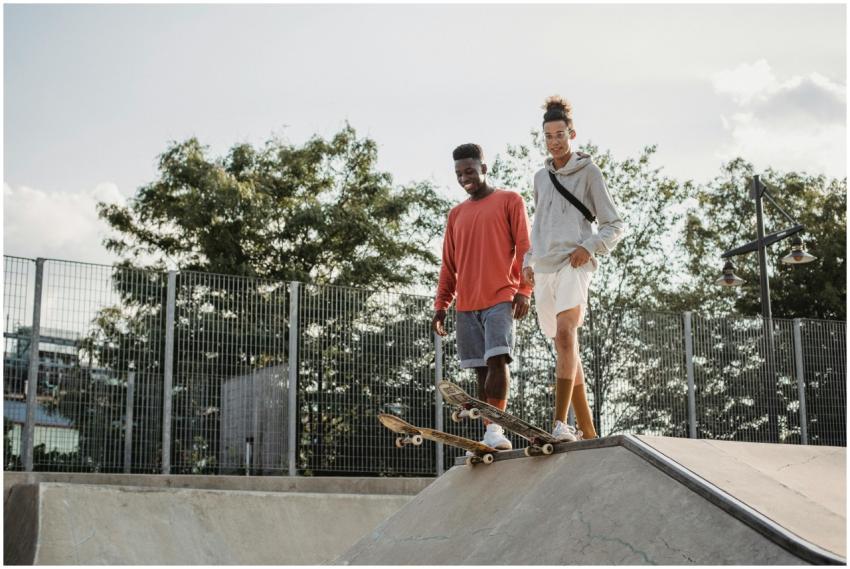 From below of happy multiethnic friends standing o