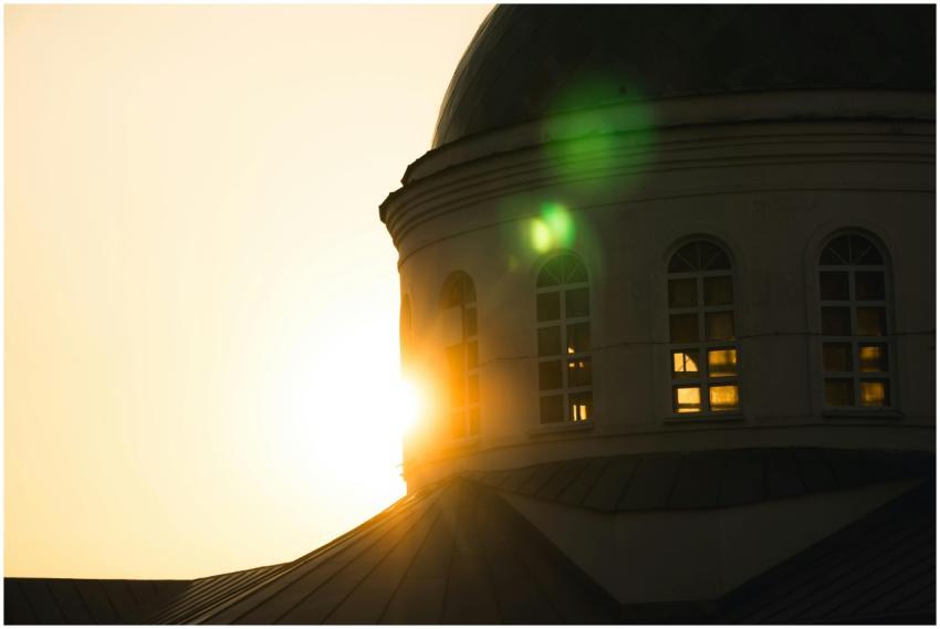 Elegant dome silhouette with sunburst and lens fla