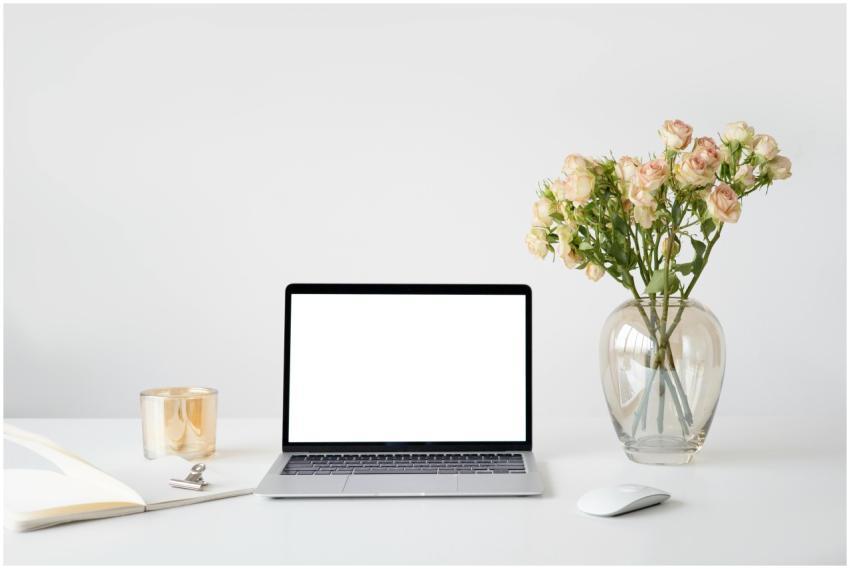 Elegant minimalist workspace featuring a laptop wi