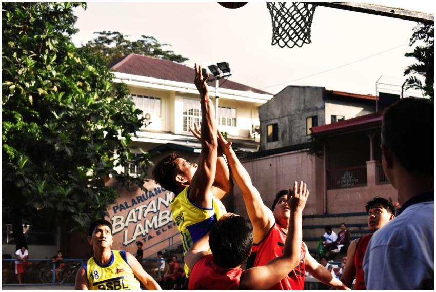 A group of young adults energetically playing an o