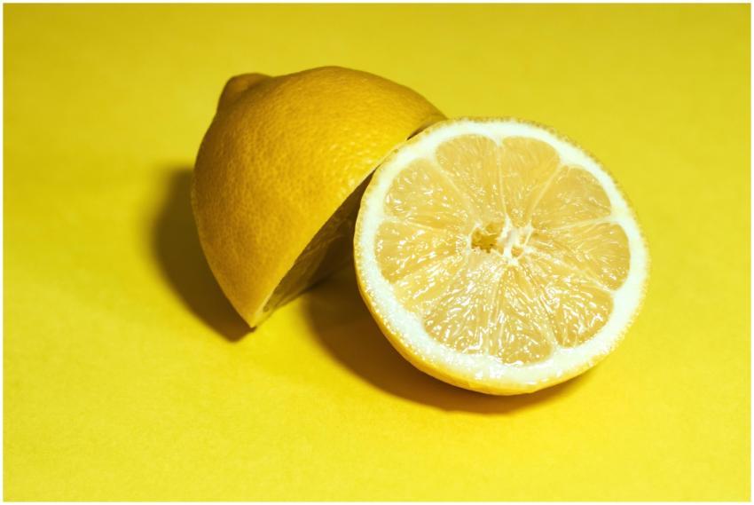 Close-up of a juicy lemon sliced in half, set agai
