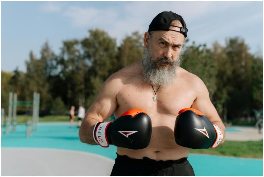 Elderly man engaged in outdoor boxing workout for