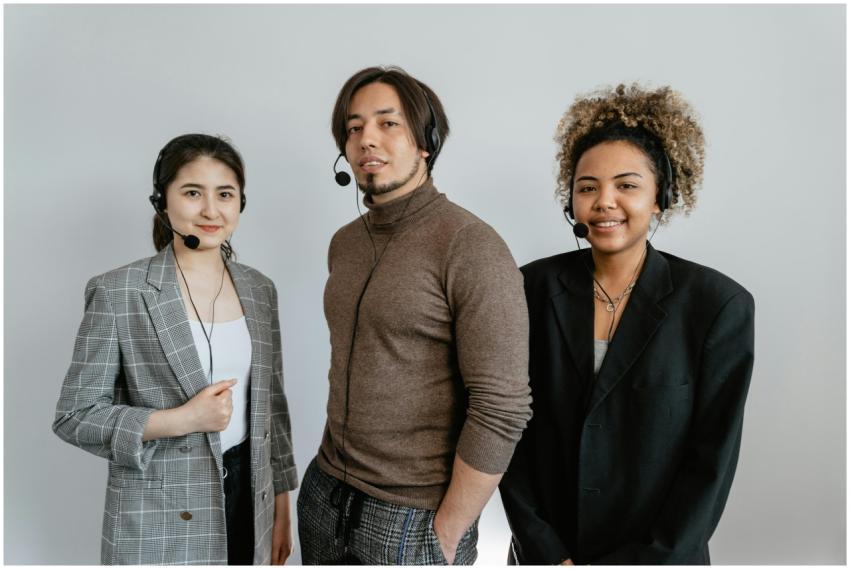 Three diverse customer support representatives wea