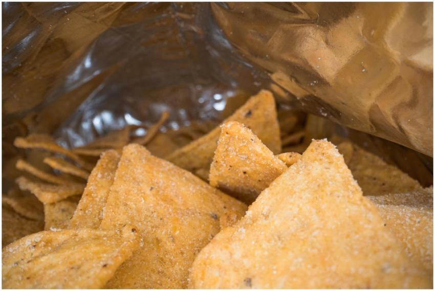 Crispy tortilla chips in a silver foil bag, perfec