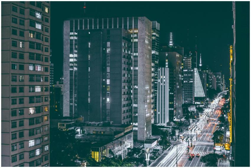 Dynamic night view of a bustling city street with