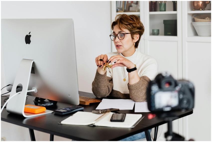 A professional woman engaged in a virtual meeting