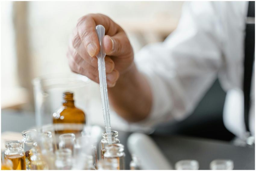 Detailed image of a person mixing essential oils i