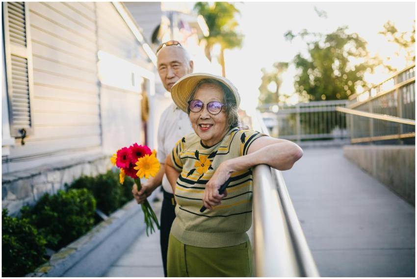 Delighted elderly couple spending time together ou