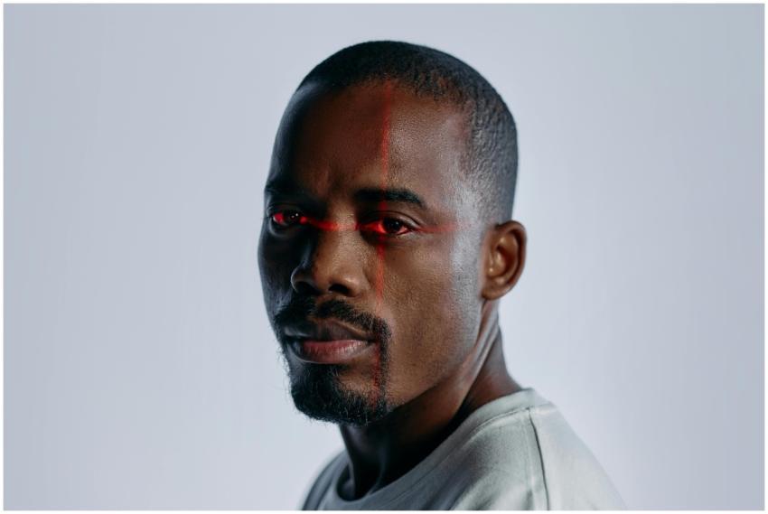 Close-up of a man with a futuristic laser scanning