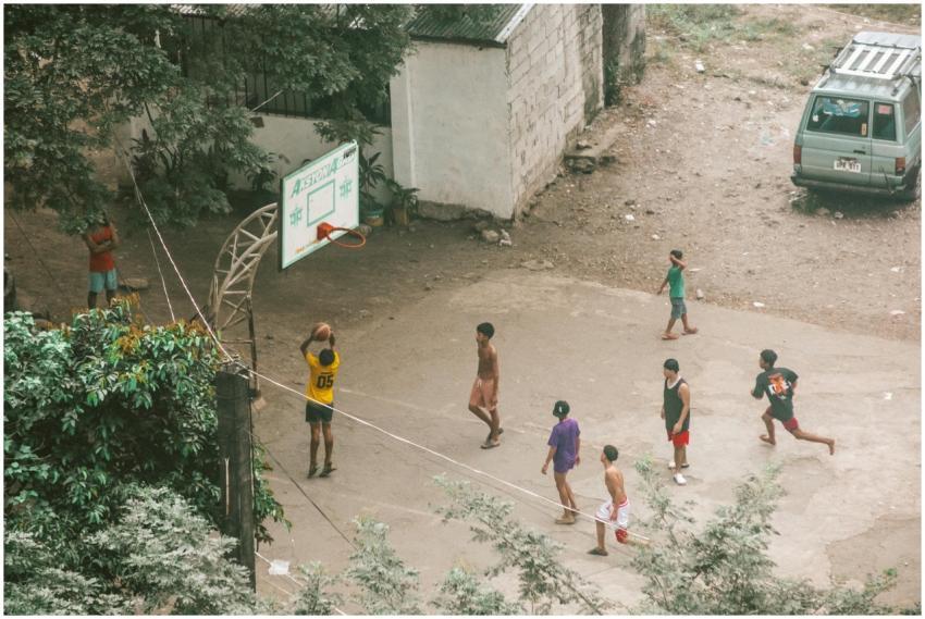 Group of young men playing a casual basketball gam