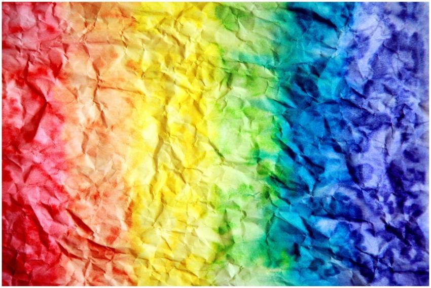 Bright and colorful rainbow gradient on crumpled p