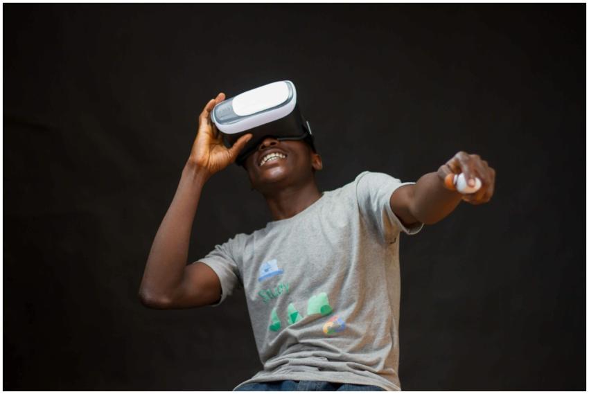 A young black man enjoying virtual reality with a