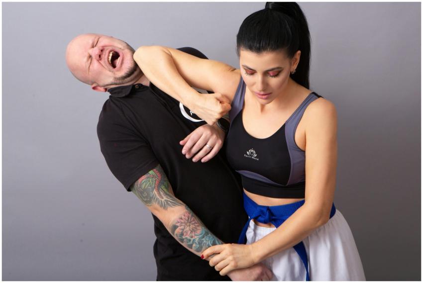 Woman in sports bra demonstrating self-defense mar