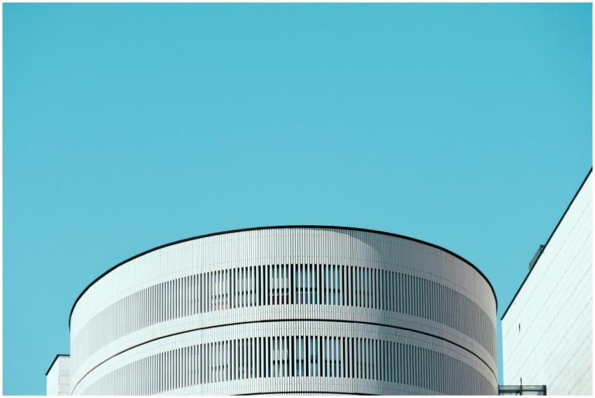 Minimalist white modern building with a clear blue