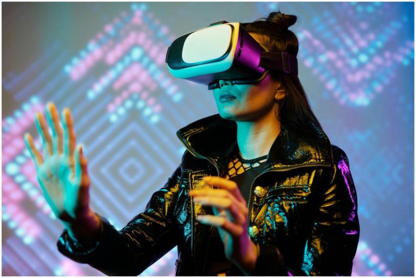 Woman using VR headset with interactive neon light