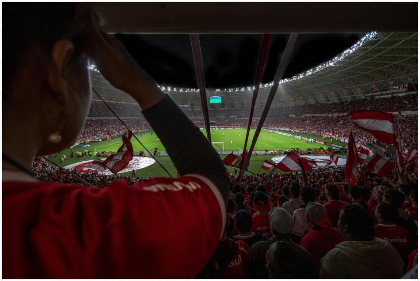 Lively soccer match at packed Brazilian stadium wi