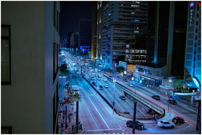 Dynamic cityscape at night featuring bustling traf