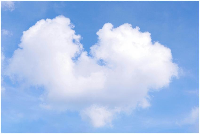 A fluffy, heart-shaped cloud set against a bright