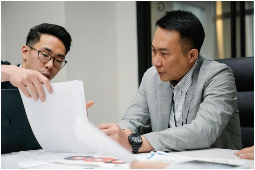 Two professional men engaged in a focused discussi