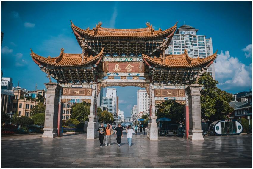 Traditional Chinese archway against Kunming city b
