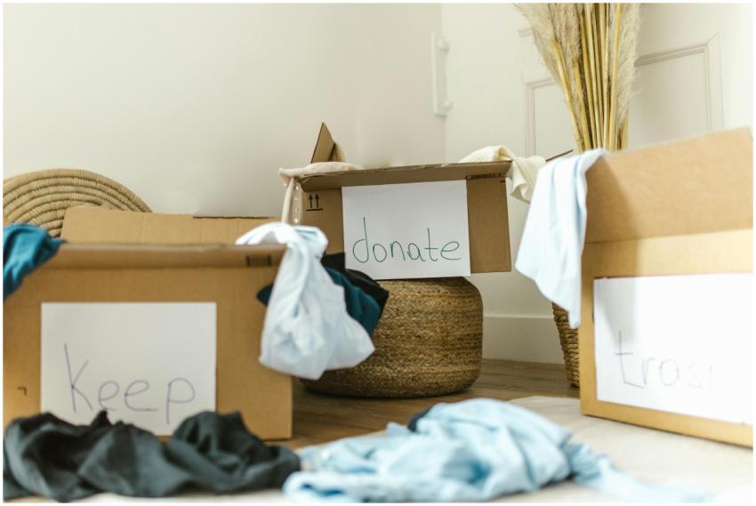 Cardboard boxes labeled keep, donate, and trash fo