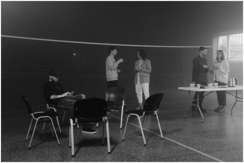 A casual indoor gathering with people engaging in