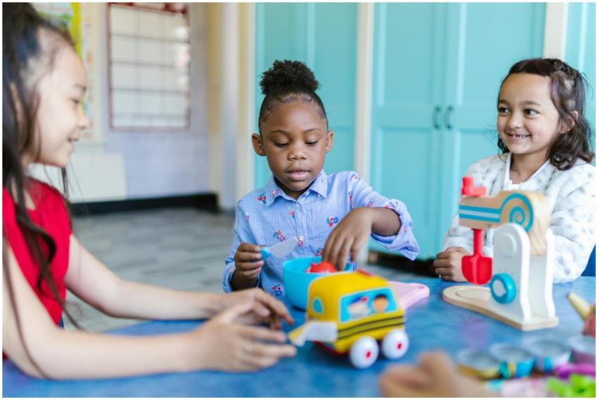 Young children playing and learning with toys in a