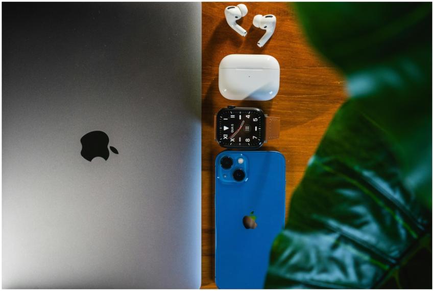 Top view of sleek gadgets including laptop, smartp