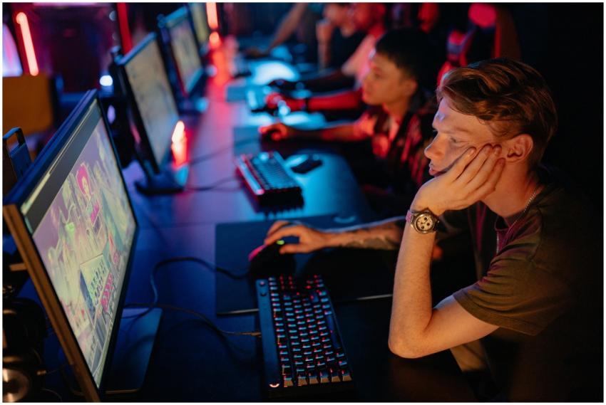 Gamers intensely focused on a computer game during