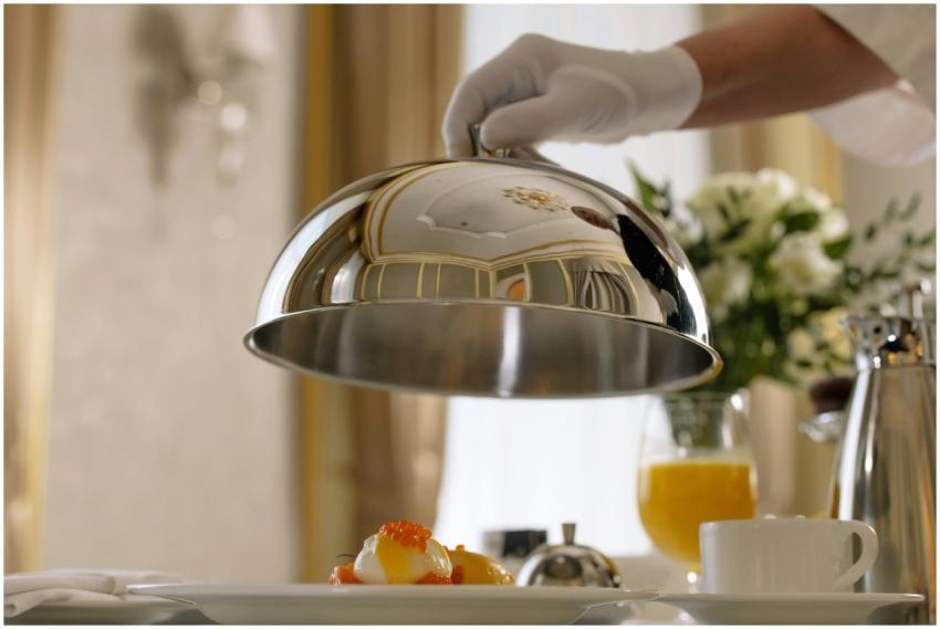 Elegant room service delivering a gourmet breakfas