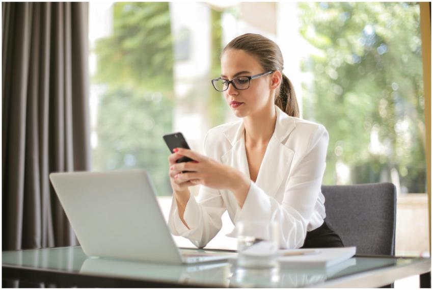 Concentrated young woman in formal clothes and eye