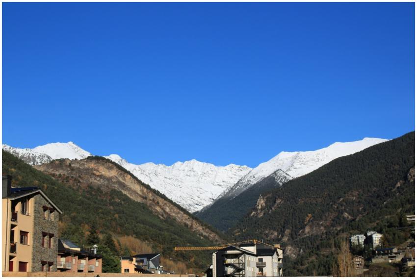 Stunning view of snow-capped mountains under a cle