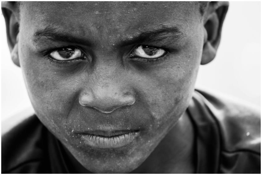 Close-up black and white portrait capturing intens