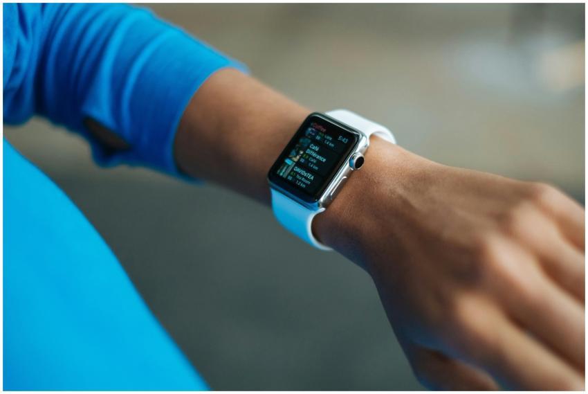 Focus on a smartwatch worn on an adult's wrist, sh