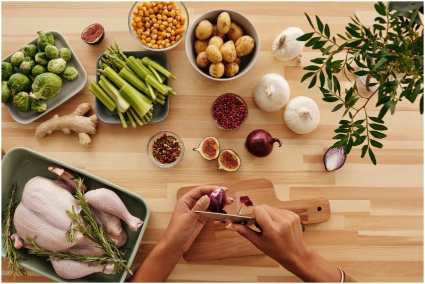 A vibrant flat lay of fresh ingredients with hands