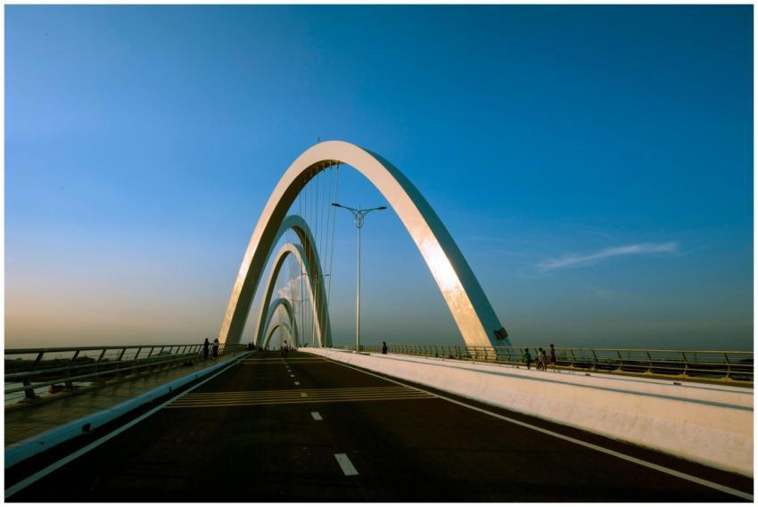 Stunning bridge with sweeping arches under a brigh