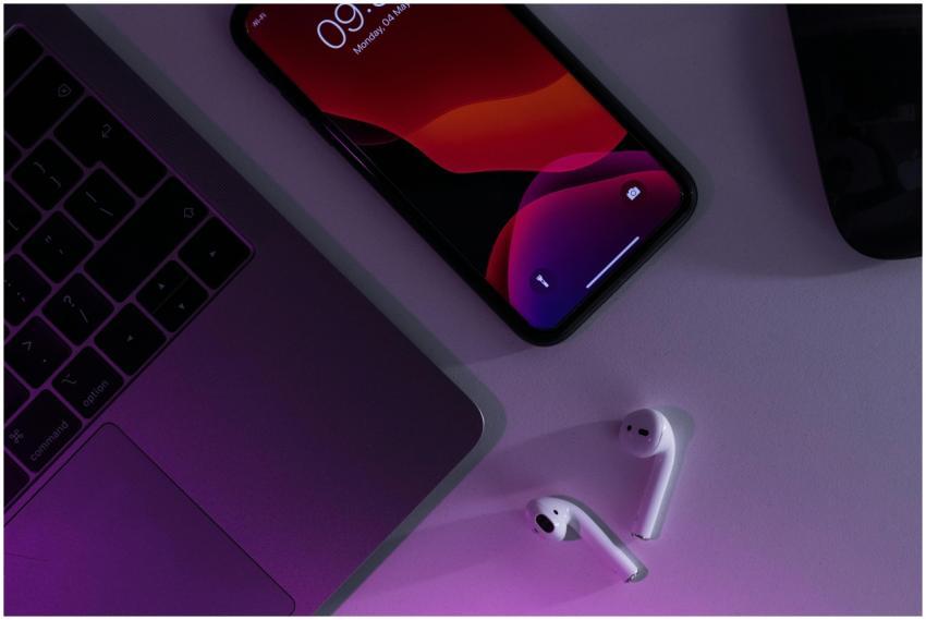 Overhead of cellphone placed near netbook and wire